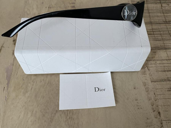 Three Capture Totale Skincare Products in a Dior Pouch | DIOR